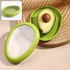 Green oval vegetable container with lid closed