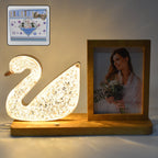 Duck-shaped crystal LED lamp glowing softly with photo frame