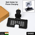 PHOBIA black mobile charging wall holder with a smartphone securely placed.