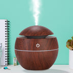 Front view of the portable USB desktop humidifier with a wood grain finish.