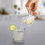 Elegant bird-shaped design of the manual lemon squeezer in use.