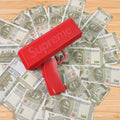 Money gun shooting play money bills at a lively party.
