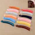 Assorted multicolor banana hair clips in a set