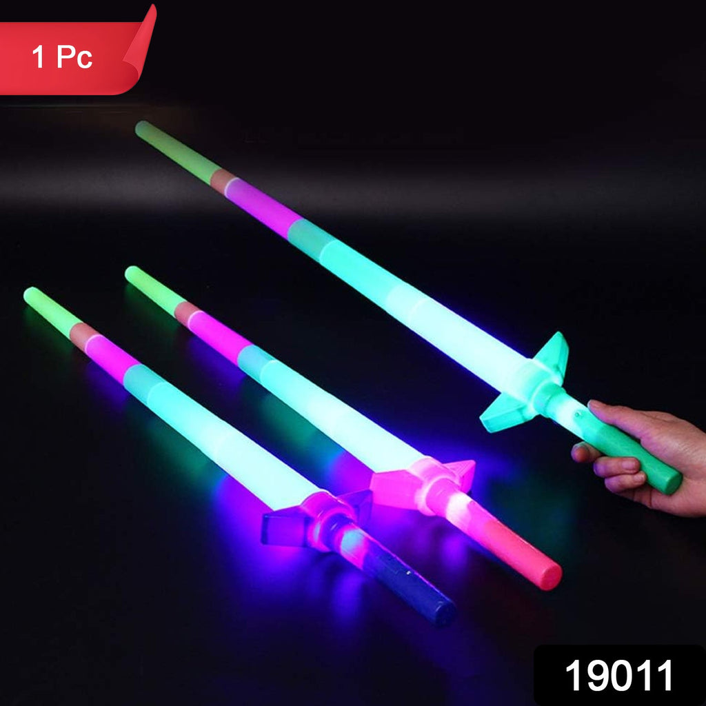 Child enjoying playing with glowing LED sword toy