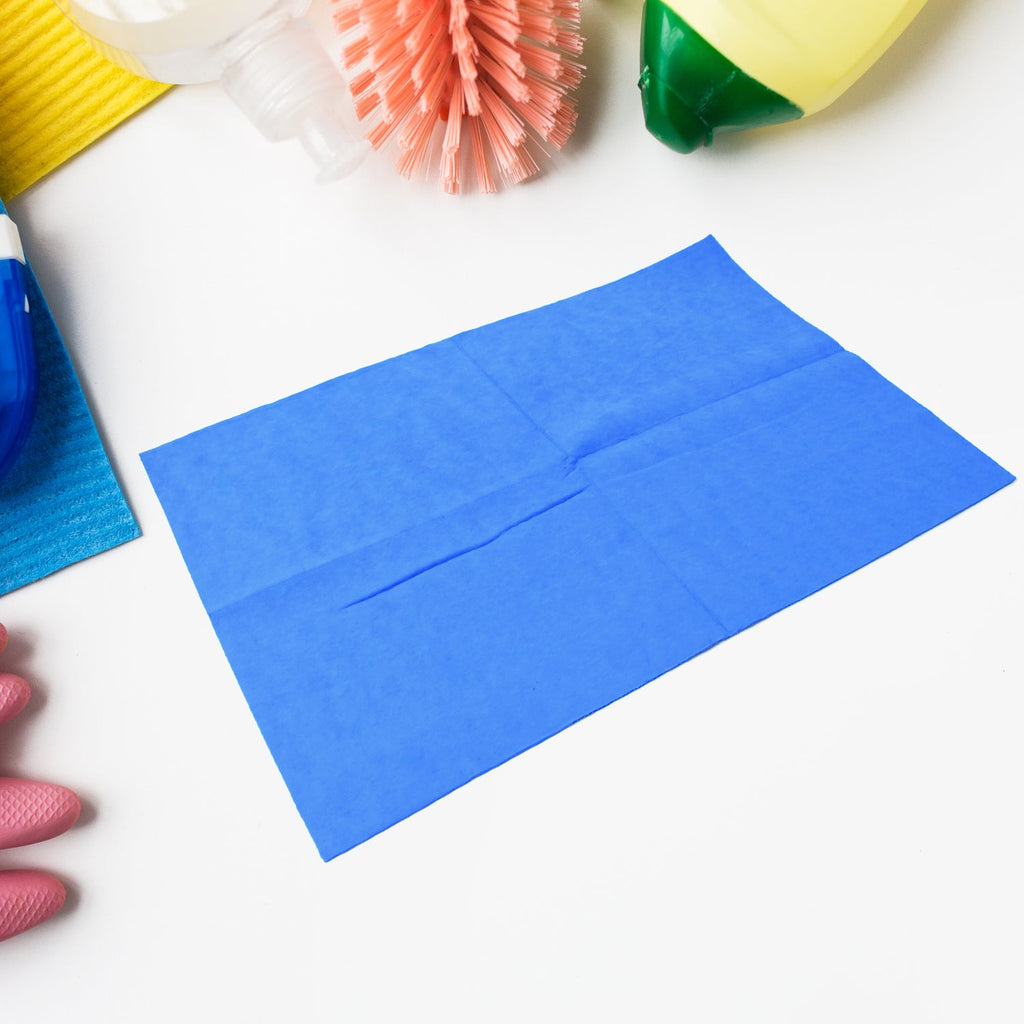 Folded Magic Cleaning Towel on a clean white surface, showcasing its texture.