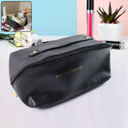 Black waterproof travel makeup organizer pouch with zipper and stitched handle