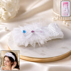 Elegant floral baby headband in soft elastic fabric with a floral bow design