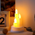 A pair of realistic LED taper candles flickering with warm white light, perfect for home decor.