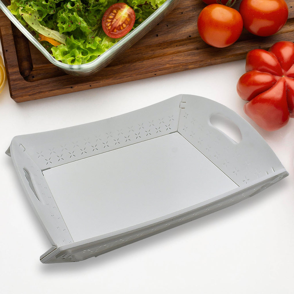 Compact folded position of the plastic serving tray, showcasing its easy storage design.