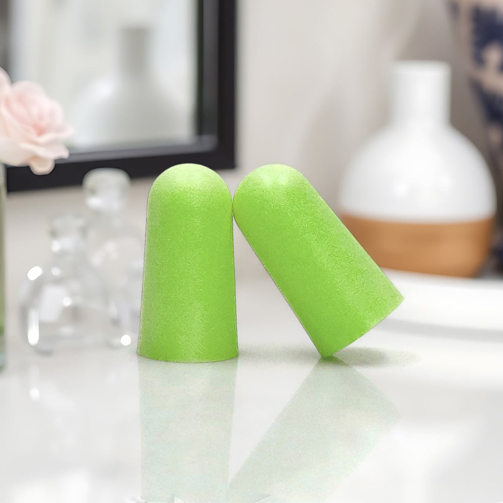 Soft foam noise reduction earplugs with storage case, ready for travel.