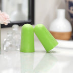 Soft foam noise reduction earplugs with storage case, ready for travel.