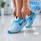 Disposable plastic shoe covers protecting shoes while in use