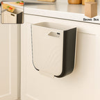 Hanging trash can in a collapsed state, showcasing its space-saving design.
