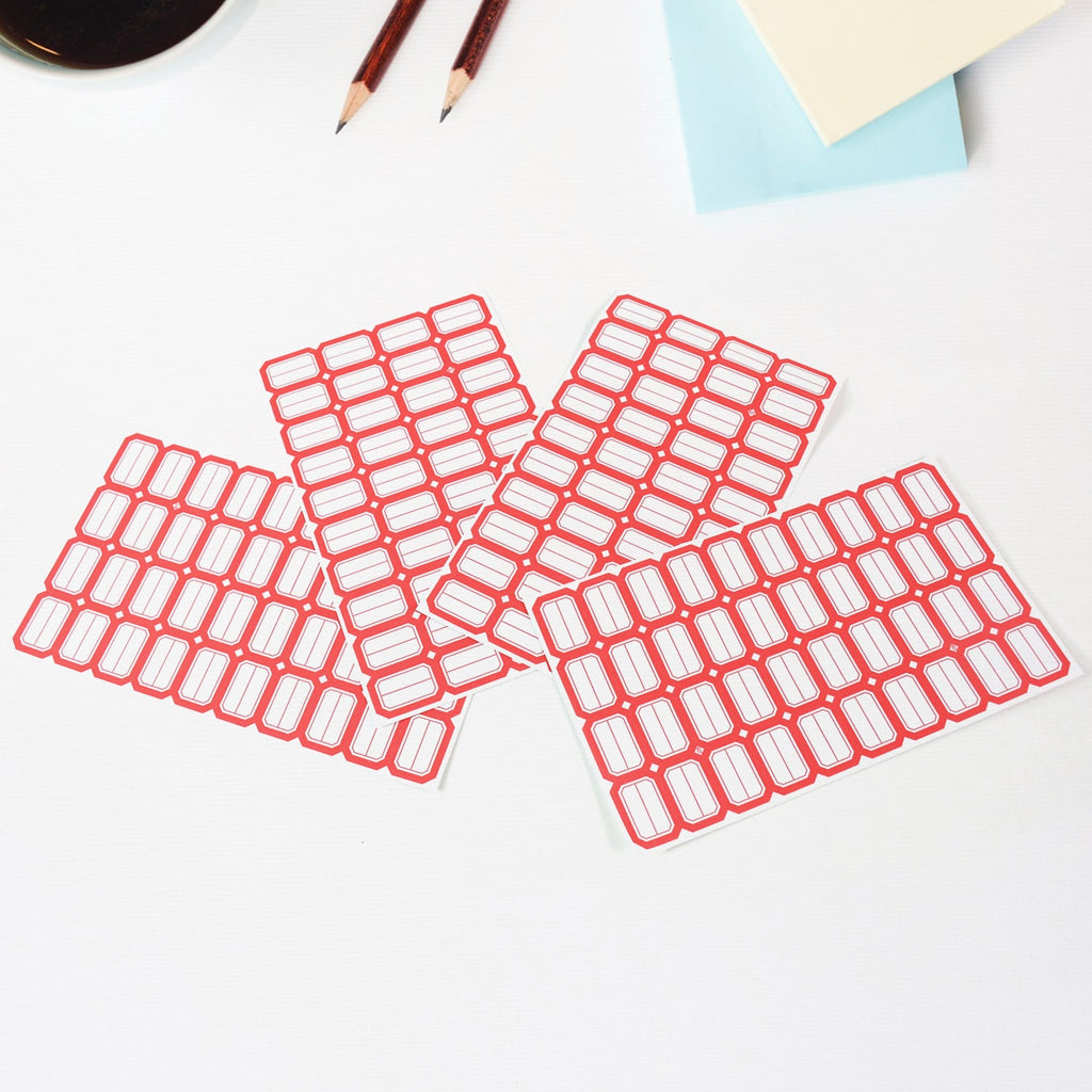 Writable label sheets on desk used for labeling office items
