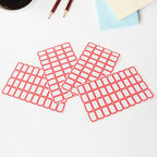 Writable label sheets on desk used for labeling office items