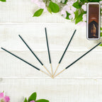 Handcrafted bundle of fragrant incense sticks, emphasizing their natural flower petal composition.