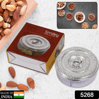 Top-down view of the smiley dry fruit box filled with snacks.