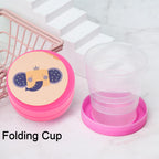 A green folding travel cup with a lid, ready for compact storage.