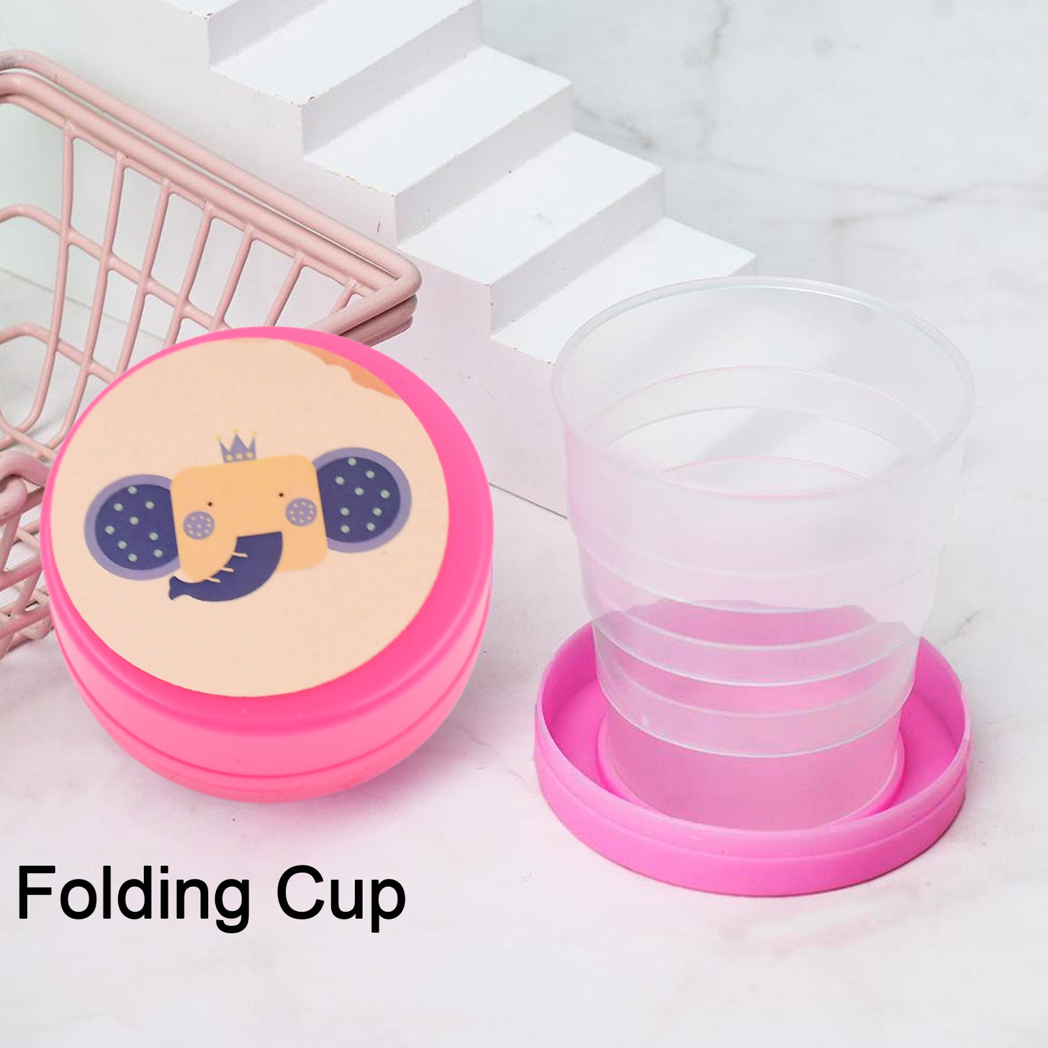 A green folding travel cup with a lid, ready for compact storage.