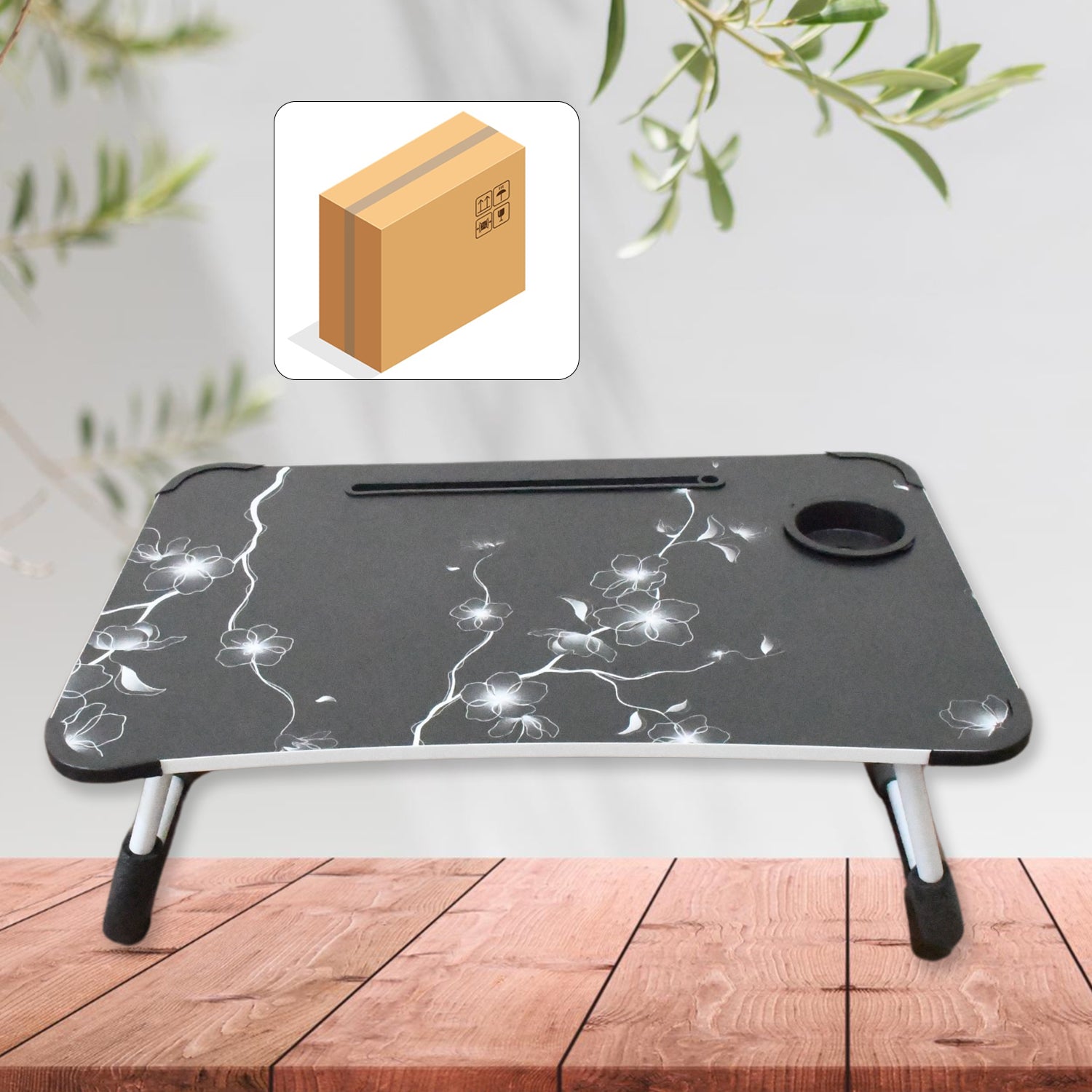 Foldable laptop table with a coffee cup slot and phone holder, ready for use on a flat surface.