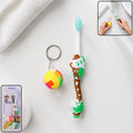 Kids toothbrush and ball toy set in colorful cartoon packaging promoting healthy habits
