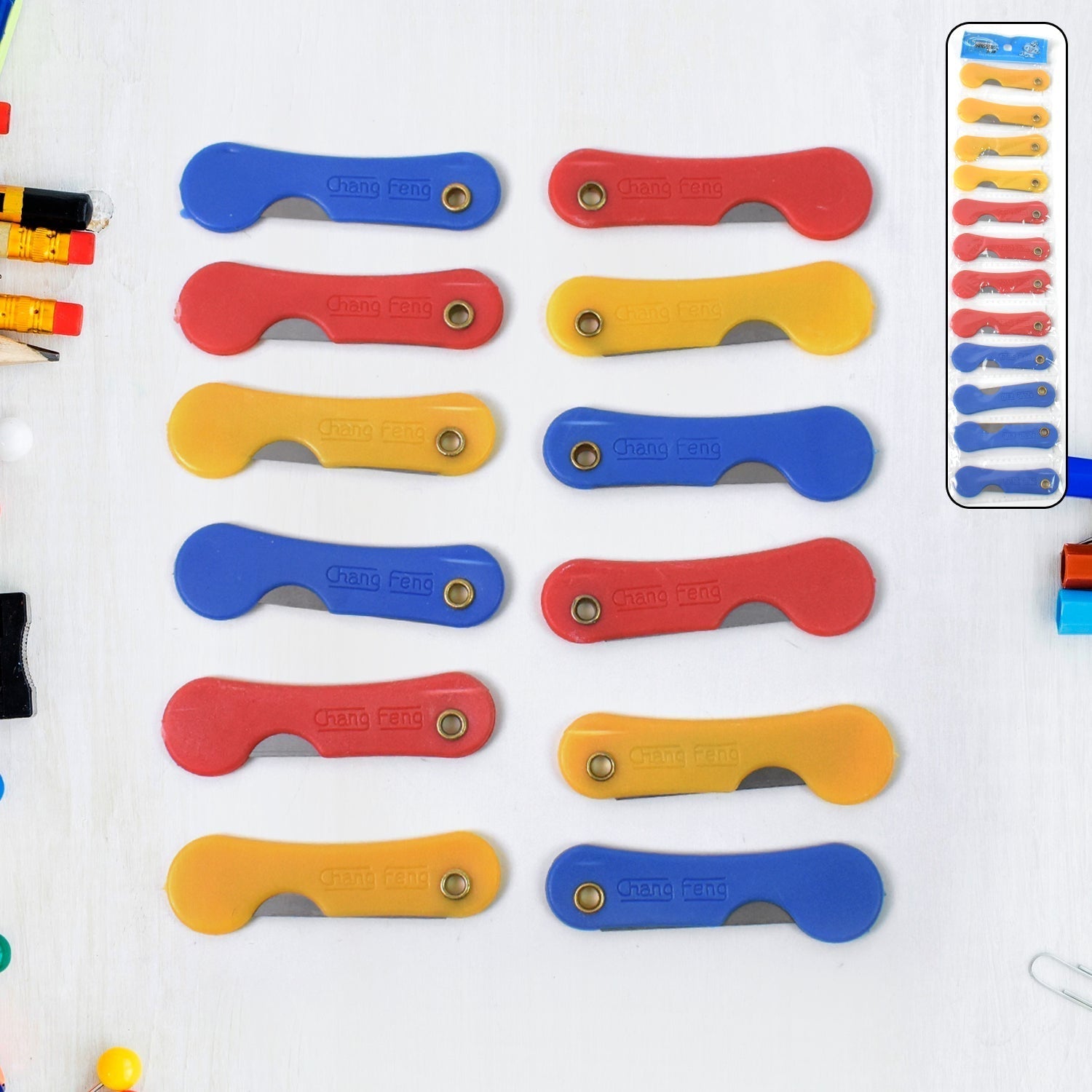 Pack of 12 multicolour mini paper cutter knives displayed neatly.