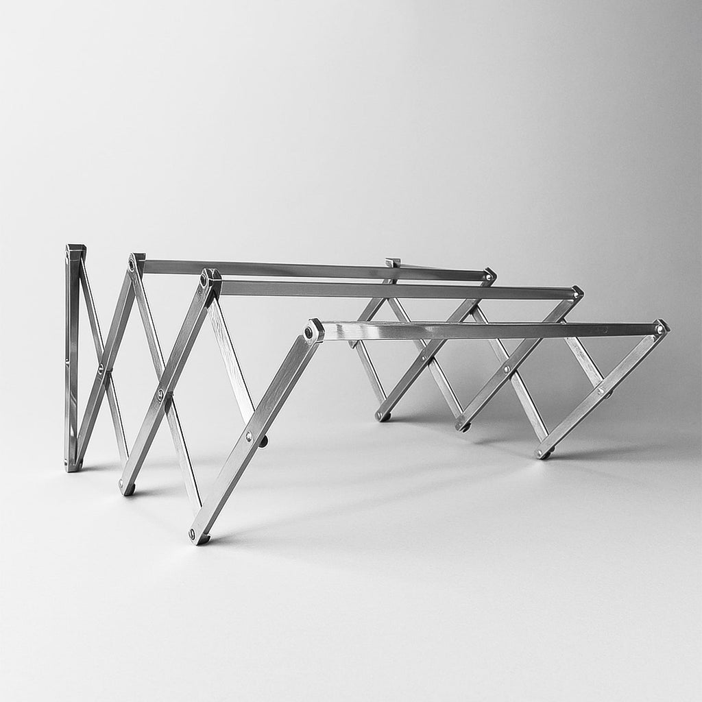 Stainless steel wall-mounted folding clothes drying rack in expanded position