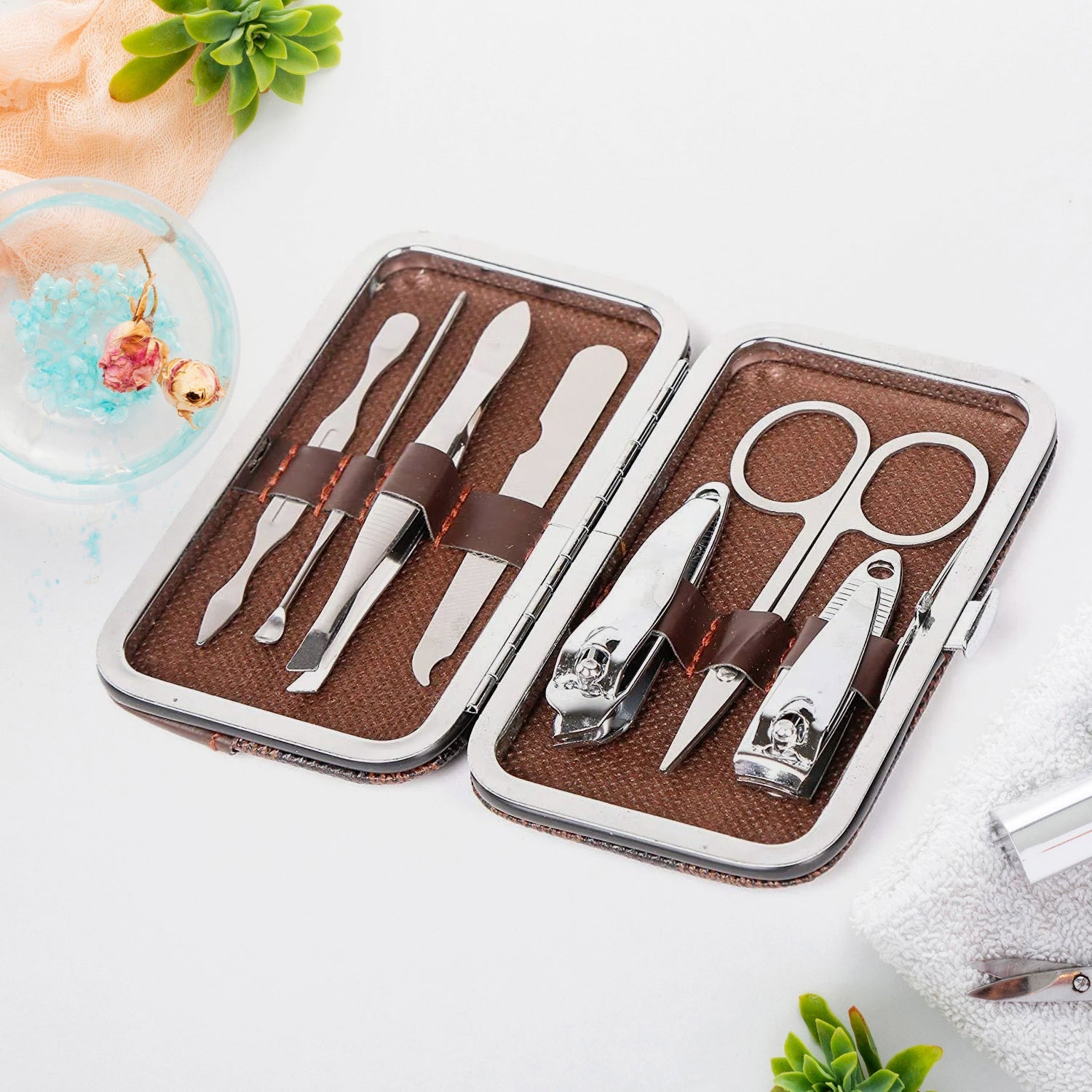 7-piece manicure pedicure kit with stainless steel tools laid out