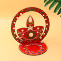 Handcrafted wooden decorative diya stand with hand-painted artwork and stones