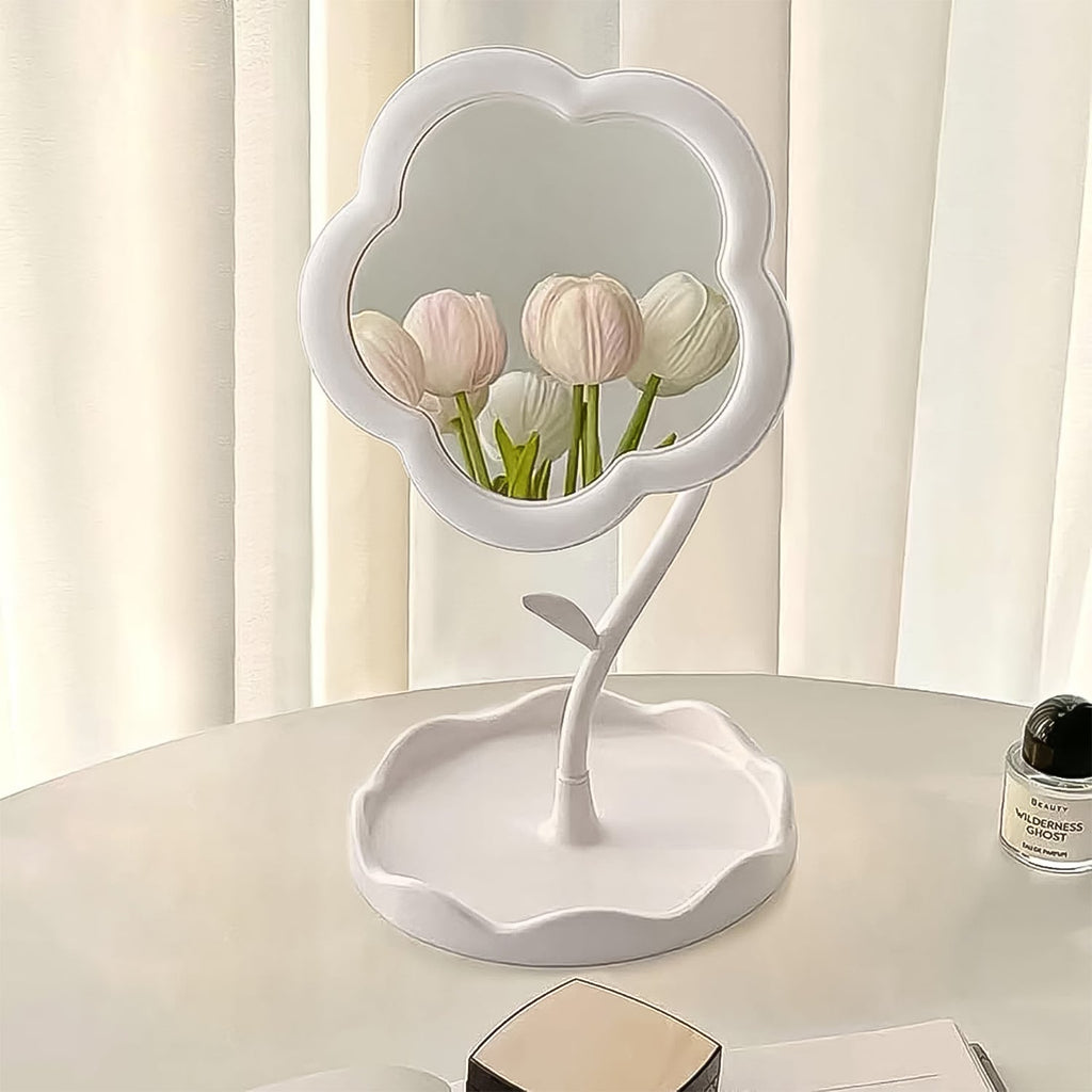 Flower-shaped makeup mirror providing clear reflection with integrated tray for essentials