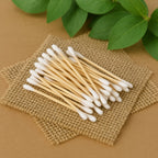 Pack of 100 eco-friendly wooden cotton ear buds with soft double tips