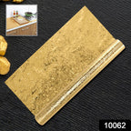 Applying the waterproof aluminum foil sticker to a kitchen surface.