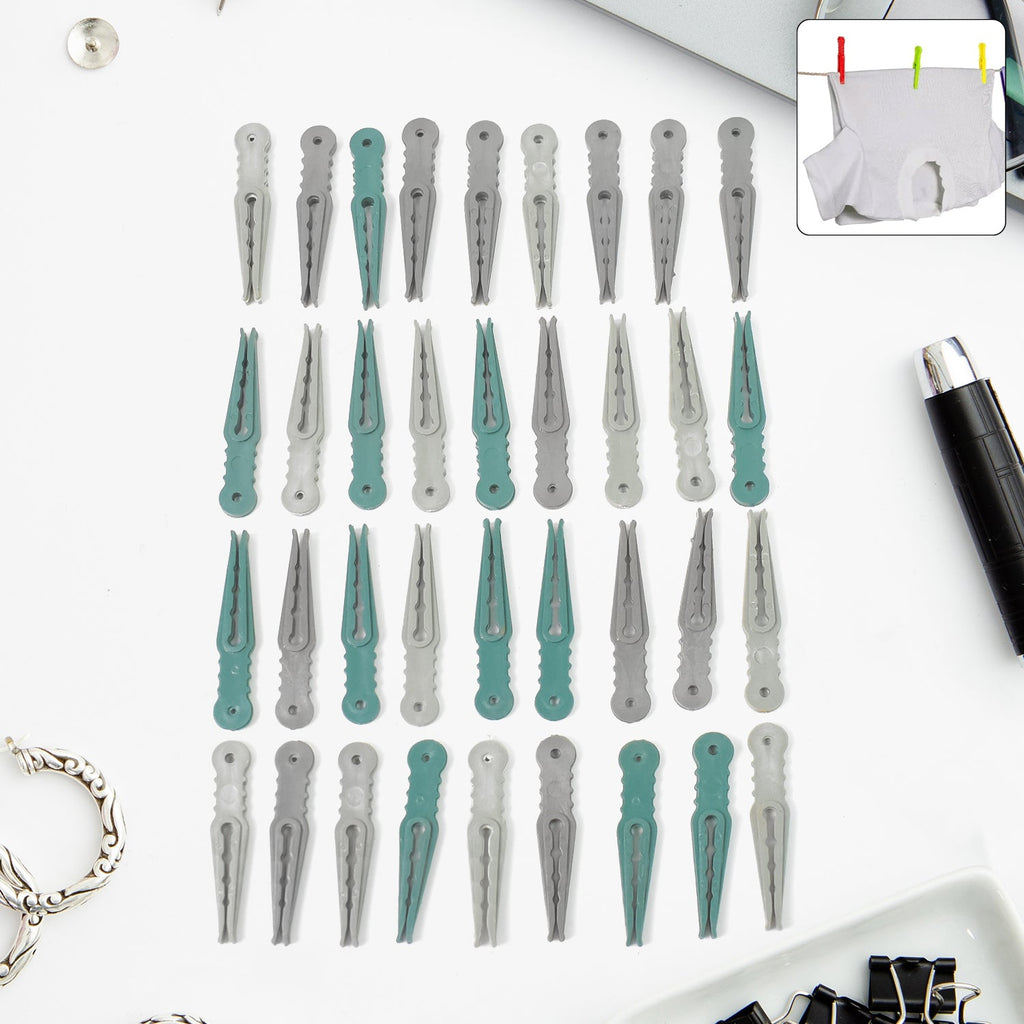 A set of 36 colourful plastic cloth pegs in a clear plastic basket, ready for laundry.