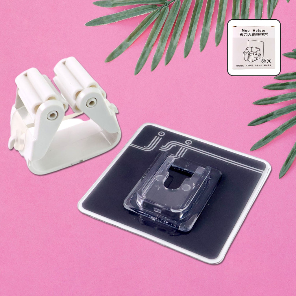 Wall mounted mop & broom holder neatly organizing cleaning tools.