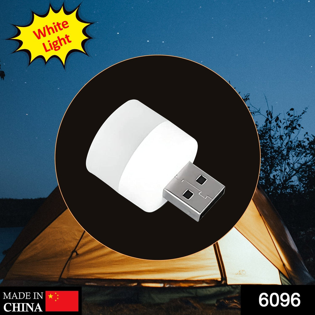 The versatile USB bulb plugged into a laptop, demonstrating its use for office lighting.