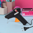 Hot Melt Glue Gun 40W in use showing rapid heating feature