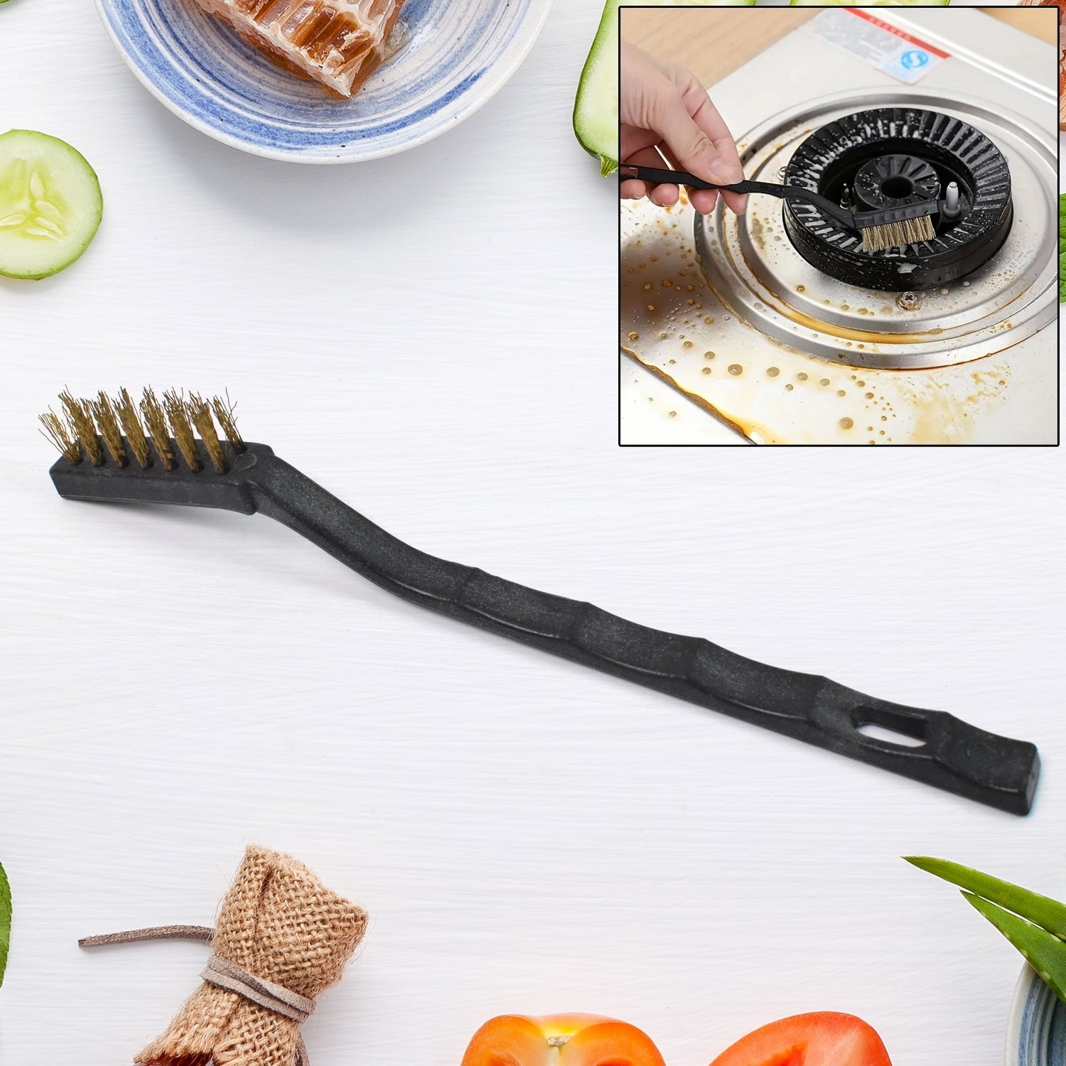Mini Brass Wire Brush for cleaning and rust removal, held against a white background.