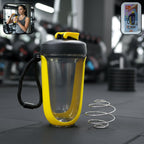 Yellow plastic shaker bottle with handle and whisk ball for smooth protein drinks