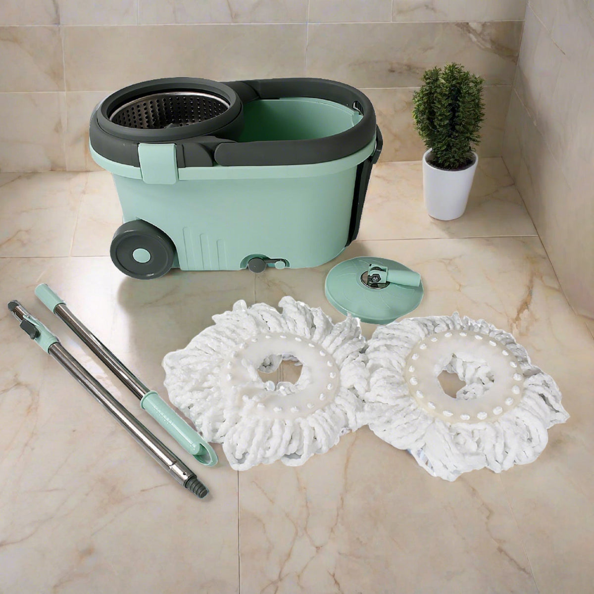 Ganesh Spin Mop with Bucket featuring a steel wringer and two microfiber mop heads.
