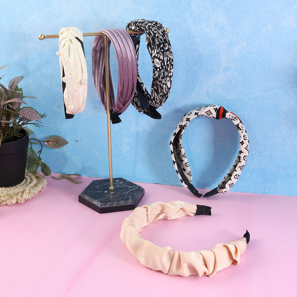 Front view of dark ribbed texture knot hairband for women