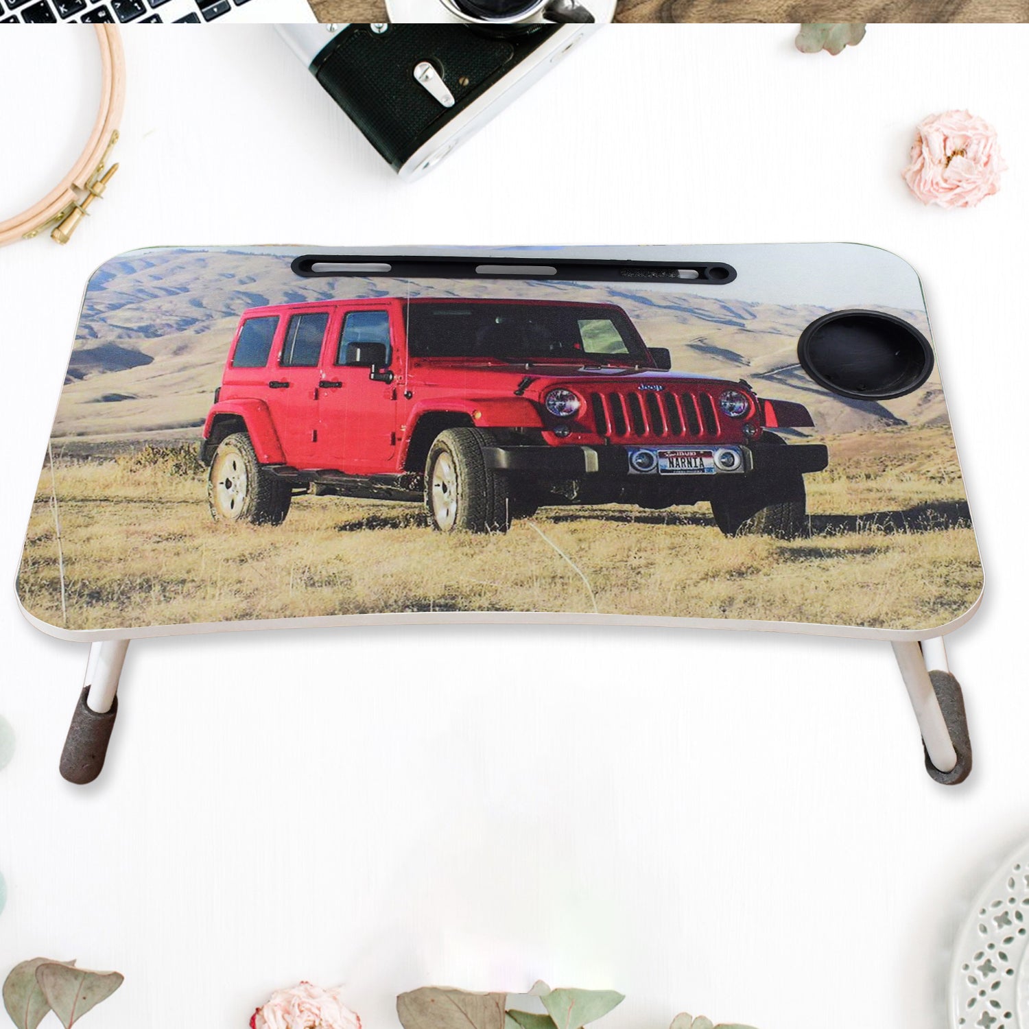 Portable writing table with a slot for tablets and smartphones.