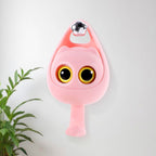 Cute wink cat adhesive coat hook securely holding keys on a bedroom wall.