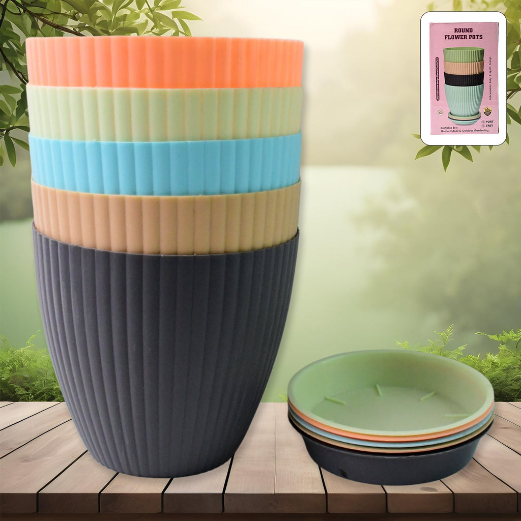 Set of five round plastic flower pots with trays displayed on a natural wooden surface.