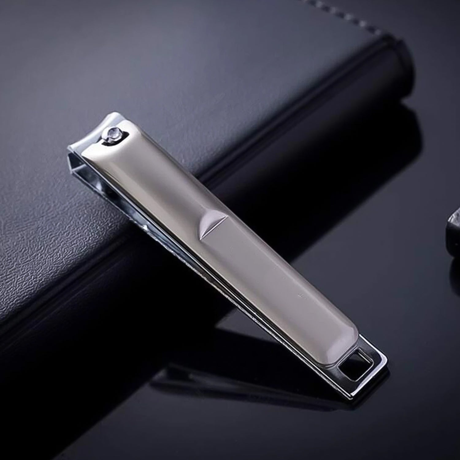 Folding mechanism of the stainless steel nail clippers, demonstrating compact storage.