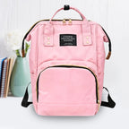 Side view of the spacious Tots Basics Diaper Bag Backpack.