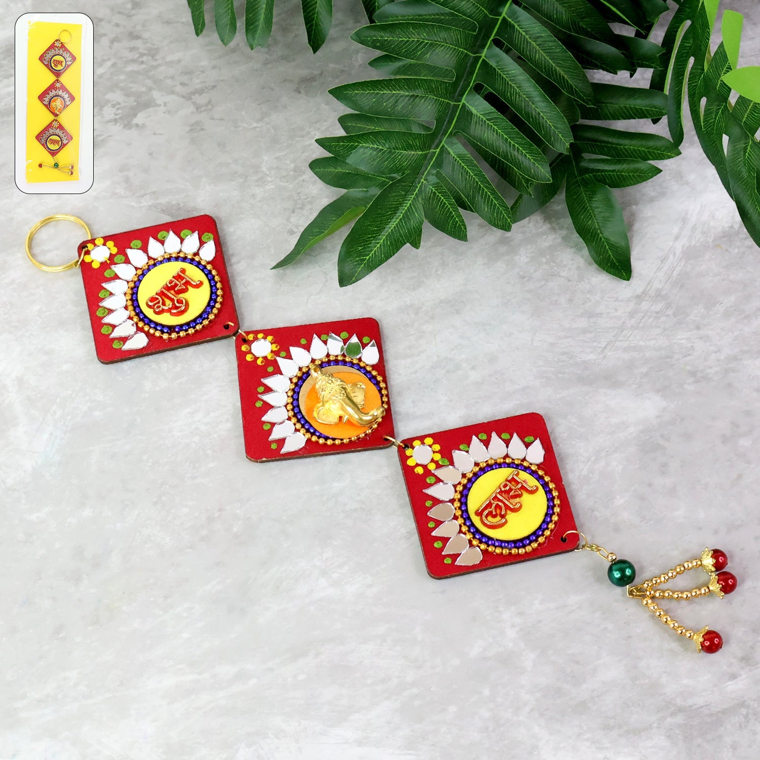 Traditional Labh Shubh wall hanging with vibrant colors and golden embellishments