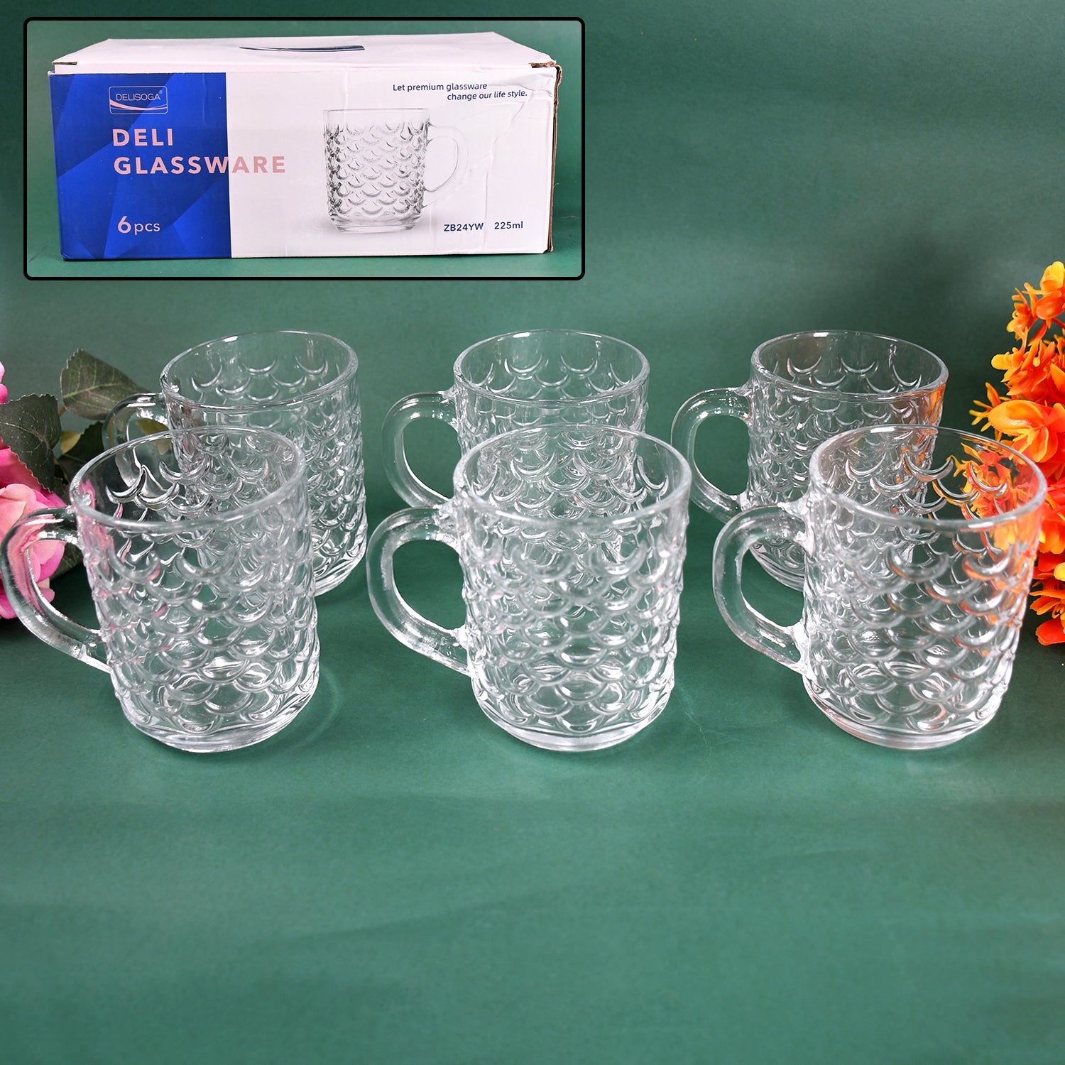 Set of six clear glass coffee mugs with handles, showcasing their elegant design.