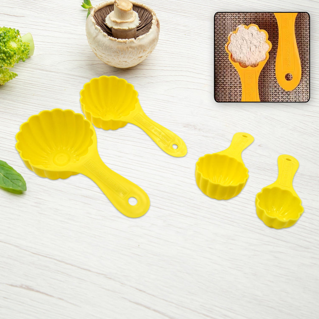 A close-up view of one durable plastic ladoo mould spoon, showing its detailed design.