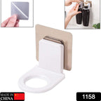 Multi-color adhesive bathroom hook mounted on a tiled wall, holding a bottle.