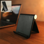 Foldable desktop mobile stand placed on kitchen counter for hands-free phone use